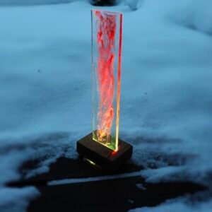 Table lamp, red, epoxy resin upright element, oak floating base.